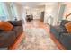 Spacious living room seamlessly connects to dining and kitchen areas for open-concept living at 110 Cedar Creek Ct, Fayetteville, GA 30215
