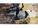 An overhead view of the house showing the roof, driveway, pool, and the surrounding yard at 3341 Deer Hollow Sw Trl, Conyers, GA 30094