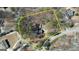 Aerial view of property lines and surrounding neighborhood, full of lush mature trees at 3341 Deer Hollow Sw Trl, Conyers, GA 30094