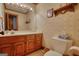 Classic bathroom with a vanity, large mirror, and charming wallpaper at 3341 Deer Hollow Sw Trl, Conyers, GA 30094