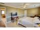 Bedroom featuring a TV, ceiling fan, and a connecting room at 3341 Deer Hollow Sw Trl, Conyers, GA 30094