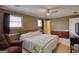 Bright bedroom with windows, a ceiling fan and comfortable furnishings at 3341 Deer Hollow Sw Trl, Conyers, GA 30094