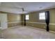 Spacious bedroom with natural light, neutral walls, and a ceiling fan at 3341 Deer Hollow Sw Trl, Conyers, GA 30094