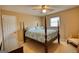Cozy bedroom featuring a four poster bed and a ceiling fan with lighting at 3341 Deer Hollow Sw Trl, Conyers, GA 30094
