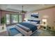 Stylishly furnished bedroom with tray ceiling and bay window at 3341 Deer Hollow Sw Trl, Conyers, GA 30094