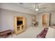 Spacious bedroom includes media cabinet, desk, chair, ceiling fan and neutral colored carpet at 3341 Deer Hollow Sw Trl, Conyers, GA 30094