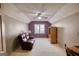 Versatile bonus room with pitched ceiling, purple accent wall, and cozy couch at 3341 Deer Hollow Sw Trl, Conyers, GA 30094