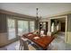 Elegant dining room featuring modern table set with china and a classic chandelier at 3341 Deer Hollow Sw Trl, Conyers, GA 30094