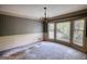 Light-filled dining room with bay window and decorative wallpaper at 3341 Deer Hollow Sw Trl, Conyers, GA 30094