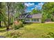 Charming two-story home with beautiful landscaping and a well-maintained lawn at 3341 Deer Hollow Sw Trl, Conyers, GA 30094