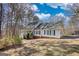 Charming two-story home with a welcoming front porch, lush landscaping and attached garage at 3341 Deer Hollow Sw Trl, Conyers, GA 30094