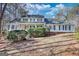 Charming two-story home with a landscaped front yard and a classic architectural style at 3341 Deer Hollow Sw Trl, Conyers, GA 30094