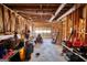 Unfinished garage with exposed wood beams, ductwork and space for riding mower at 3341 Deer Hollow Sw Trl, Conyers, GA 30094