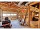 Spacious garage with a lawn mower, storage and access to the home's interior at 3341 Deer Hollow Sw Trl, Conyers, GA 30094