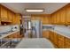 Functional kitchen with hardwood floors, stainless steel refrigerator, and white countertops at 3341 Deer Hollow Sw Trl, Conyers, GA 30094