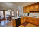 Eat-in kitchen area showcases hardwood floors, wood cabinets, and stainless steel sink at 3341 Deer Hollow Sw Trl, Conyers, GA 30094