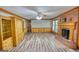 Inviting living room featuring a brick fireplace, hardwood floors, and built-in cabinets at 3341 Deer Hollow Sw Trl, Conyers, GA 30094