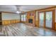 Comfortable living room boasts a brick fireplace, hardwood floors, and natural light at 3341 Deer Hollow Sw Trl, Conyers, GA 30094