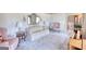 Bright living room with light carpet, vintage furniture, and natural lighting at 3341 Deer Hollow Sw Trl, Conyers, GA 30094