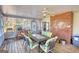 Covered patio with furniture, brick detail and ceiling fan at 3341 Deer Hollow Sw Trl, Conyers, GA 30094