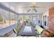 Relaxing covered patio featuring a dining set and comfortable seating at 3341 Deer Hollow Sw Trl, Conyers, GA 30094