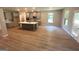Modern kitchen with gray cabinets, stainless steel appliances, a center island, and lots of natural light at 165 Jodi Pl, Locust Grove, GA 30248