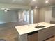 Well-designed kitchen with stainless steel appliances, a kitchen island, and seamlessly connects to other living spaces at 165 Jodi Pl, Locust Grove, GA 30248