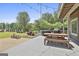 Back deck with wood table and chairs with a view of the backyard at 780 Birkdale Dr, Fayetteville, GA 30215