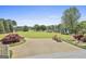 Beautiful backyard featuring ample greenspace and wood chairs at 780 Birkdale Dr, Fayetteville, GA 30215