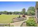 Well-maintained backyard with lush lawn, rock garden, and mature trees at 780 Birkdale Dr, Fayetteville, GA 30215