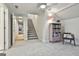 Fully finished basement featuring carpet floors, a staircase, and bonus hall access, offering versatile space for recreation at 780 Birkdale Dr, Fayetteville, GA 30215