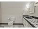 Bathroom featuring black and white tile floor and white cabinet at 780 Birkdale Dr, Fayetteville, GA 30215