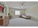 Spacious bedroom featuring a ceiling fan, a window, and carpet flooring at 780 Birkdale Dr, Fayetteville, GA 30215