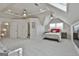 The upper level bonus room has multiple beds, with lots of natural light and ceiling fans, providing a versatile space at 780 Birkdale Dr, Fayetteville, GA 30215
