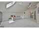 The upper level bonus room has multiple beds, with lots of natural light, providing a versatile space for activities at 780 Birkdale Dr, Fayetteville, GA 30215