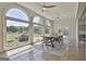 Bright dining room featuring large arched windows that offer plenty of natural light and scenic outdoor views at 780 Birkdale Dr, Fayetteville, GA 30215
