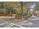 Community entrance featuring a brick sign, landscaping, and gate house at 780 Birkdale Dr, Fayetteville, GA 30215