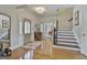 Elegant foyer with hardwood floors, staircase, and a chandelier, creating a grand entrance at 780 Birkdale Dr, Fayetteville, GA 30215