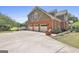 Spacious three-car garage with an attached finished bonus room above offering plenty of storage at 780 Birkdale Dr, Fayetteville, GA 30215
