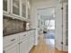 Kitchen features granite counters, modern cabinets, and stylish tile, creating an elegant workspace at 780 Birkdale Dr, Fayetteville, GA 30215