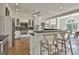 Bright kitchen with stainless steel appliances, stone backsplash, and a large island perfect for entertaining at 780 Birkdale Dr, Fayetteville, GA 30215