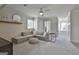 Spacious room offering lots of natural light with neutral paint and carpet, cozy couch, and stylish decor at 780 Birkdale Dr, Fayetteville, GA 30215
