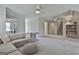 Spacious upstairs living area with comfortable seating, neutral tones, and access to additional rooms at 780 Birkdale Dr, Fayetteville, GA 30215