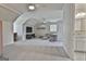 Expansive room with cozy seating, entertainment center, and an open doorway leading to a bathroom at 780 Birkdale Dr, Fayetteville, GA 30215