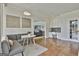 Comfortable living room with a cozy sofa, decorative art, and convenient access to a built-in office nook at 780 Birkdale Dr, Fayetteville, GA 30215