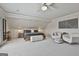 Spacious main bedroom with a king bed, ceiling fan, and modern decor at 780 Birkdale Dr, Fayetteville, GA 30215