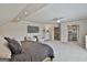 Spacious primary bedroom with light gray carpet, ceiling fan, and sitting area at 780 Birkdale Dr, Fayetteville, GA 30215