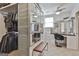 This walk-in closet has custom shelves and clothes racks with a makeup vanity, mirror, and natural light at 780 Birkdale Dr, Fayetteville, GA 30215