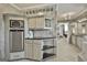 Stylish wet bar with stainless steel appliances and ample cabinet space at 780 Birkdale Dr, Fayetteville, GA 30215