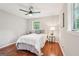 Inviting bedroom with hardwood floors, ceiling fan, and lots of natural light at 1120 Starline Dr, Smyrna, GA 30080